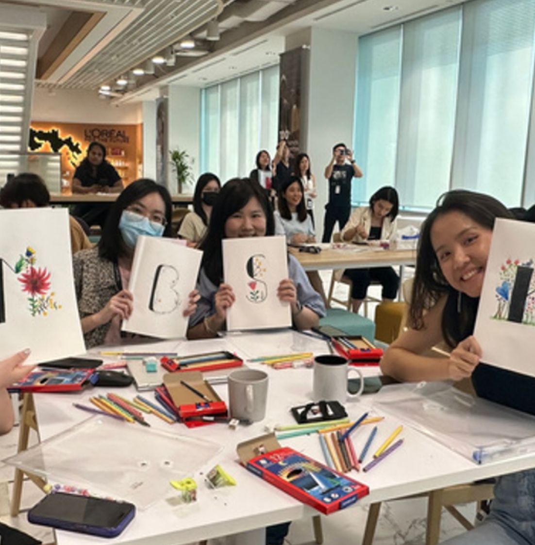 DBD HUB Express Yourself with Art workshop—employees engaging in creative art activities with paints, canvases, and tools, promoting mental wellness, self-expression, and workplace creativity.