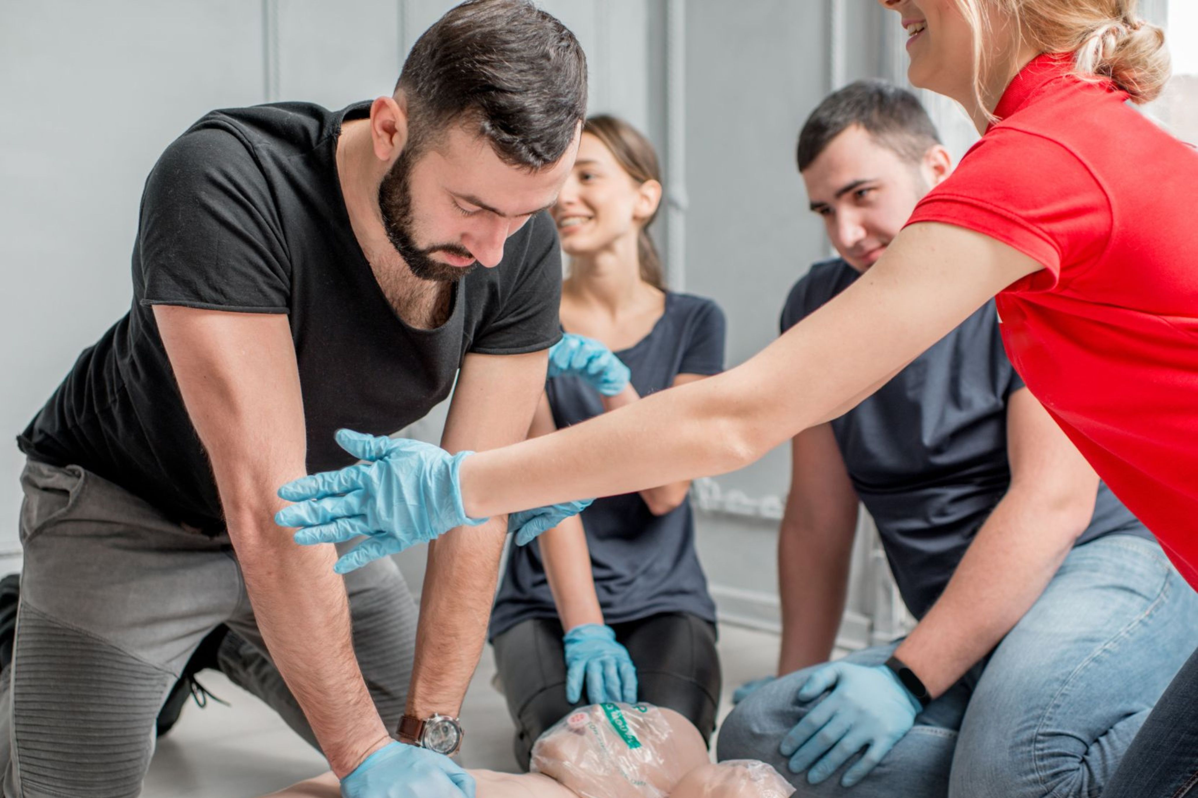 DBD HUB corporate wellness first aid training in Singapore with employees learning CPR and emergency response skills as part of workplace safety and employee preparedness programmes.