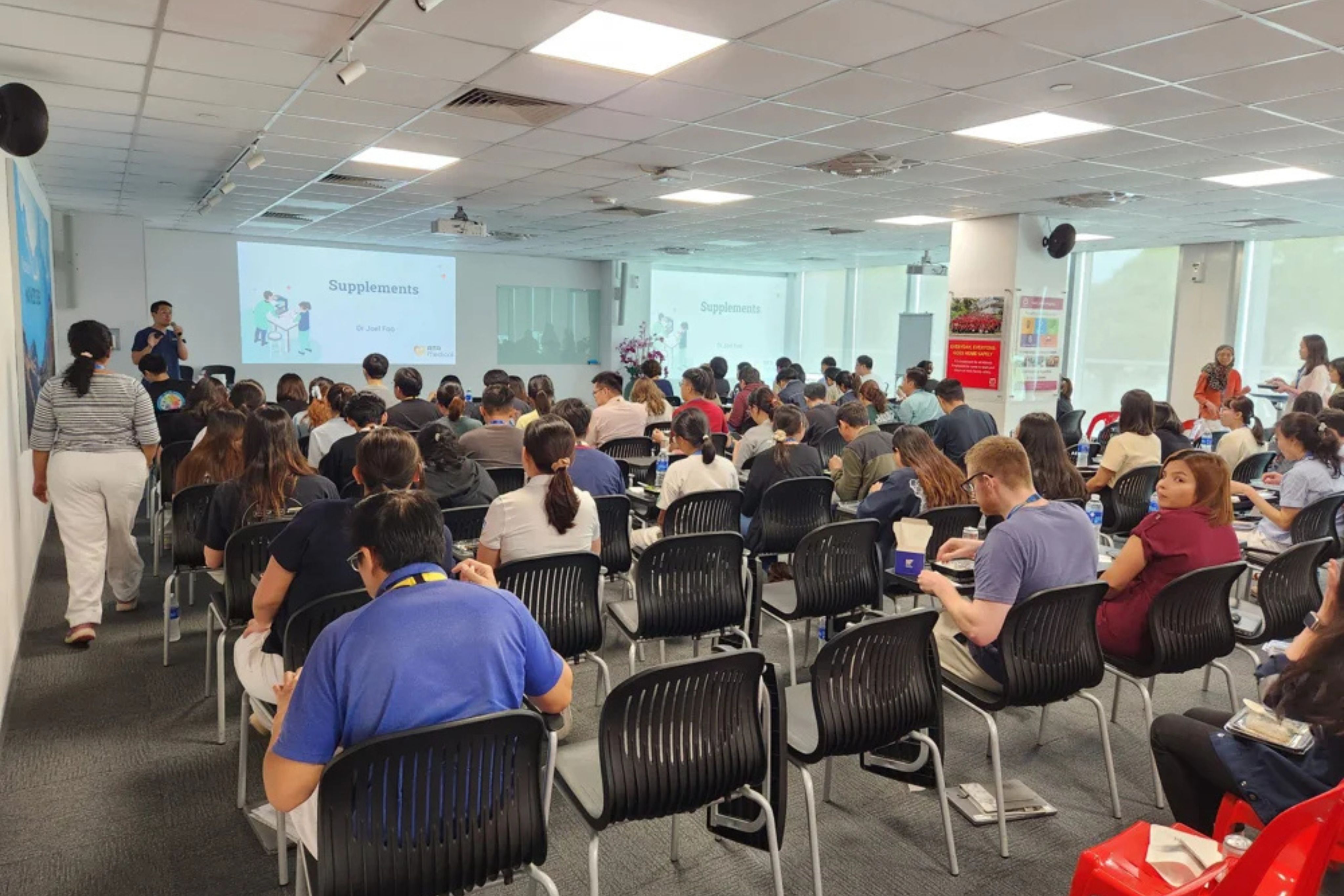DBD HUB corporate wellness health screening in Singapore with employees undergoing biometric testing and health assessments as part of workplace wellness and preventive care programmes.