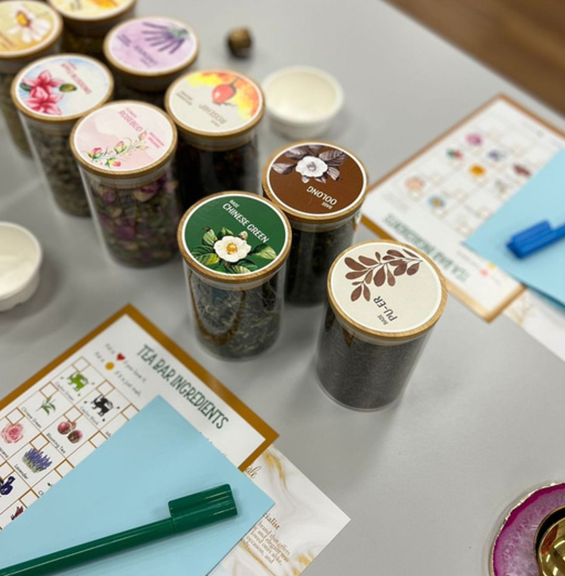 DBD HUB Tea Talk & Blending Workshop—display of natural tea ingredients and blending tools used by employees to explore herbal wellness, hands-on tea crafting, and team bonding in a corporate wellness session.