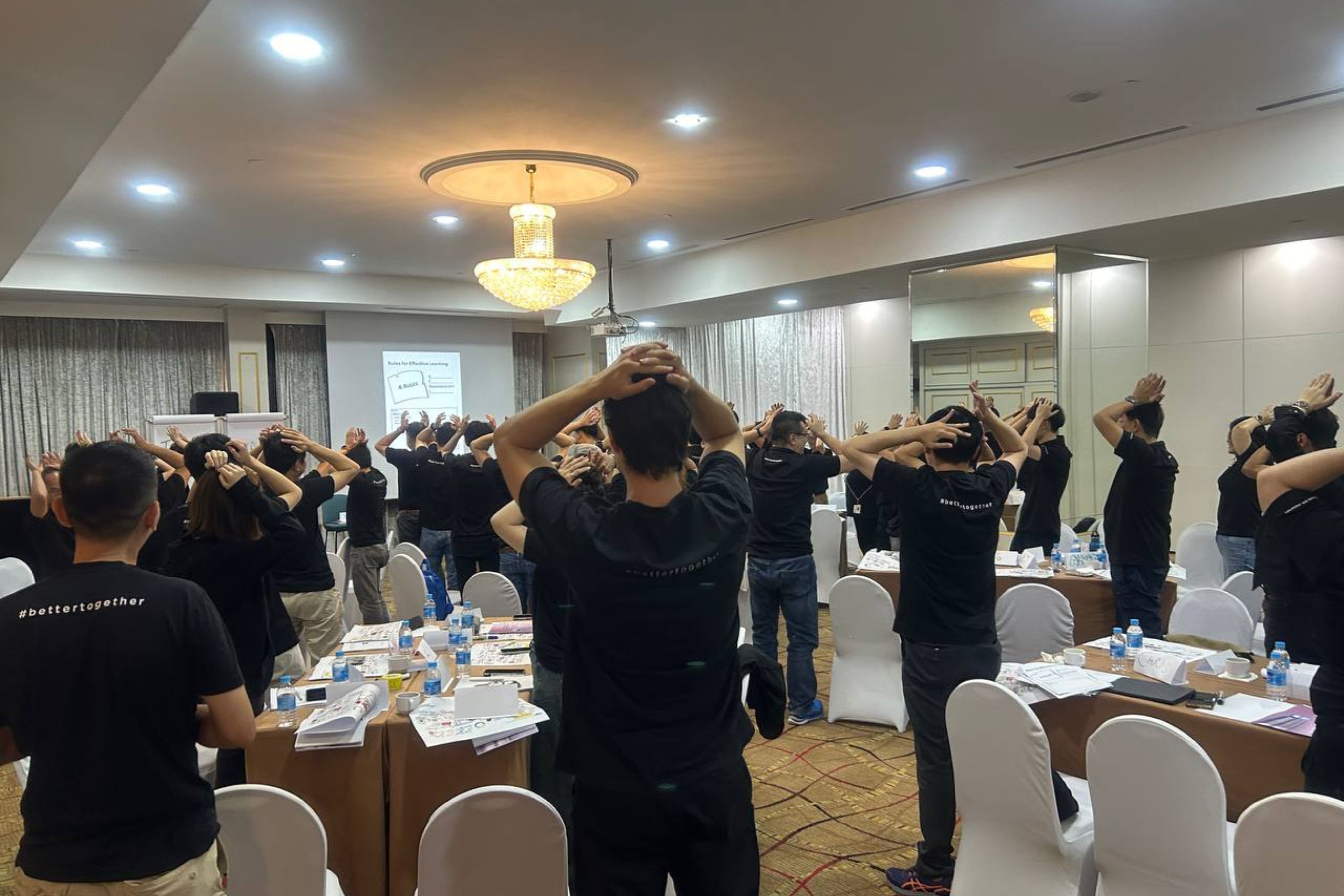 DBD HUB corporate wellness team bonding programme in Singapore with employees engaging in team building activities to enhance workplace culture, employee engagement, and collaborative skills.