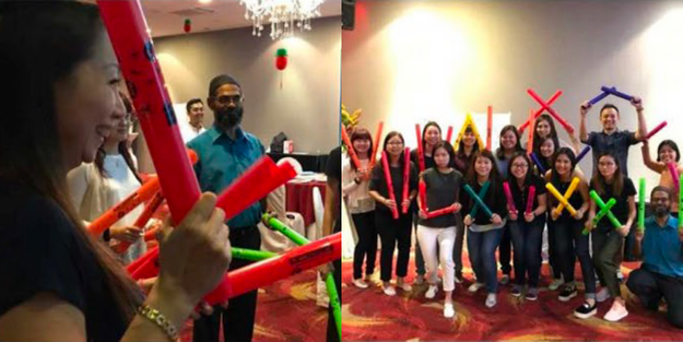 DBD HUB corporate wellness customised team building activity in Singapore featuring employees participating in the Boom Shakalaka challenge to build team spirit, coordination, and workplace camaraderie.