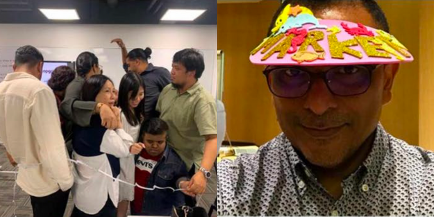 DBD HUB corporate wellness customised team building activity in Singapore featuring employees participating in The Fish Market simulation to develop customer-centric thinking, strategic decision-making, and cross-functional teamwork in a fast-paced business scenario.